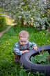© Elena  - little boy in a cherry blossom garden