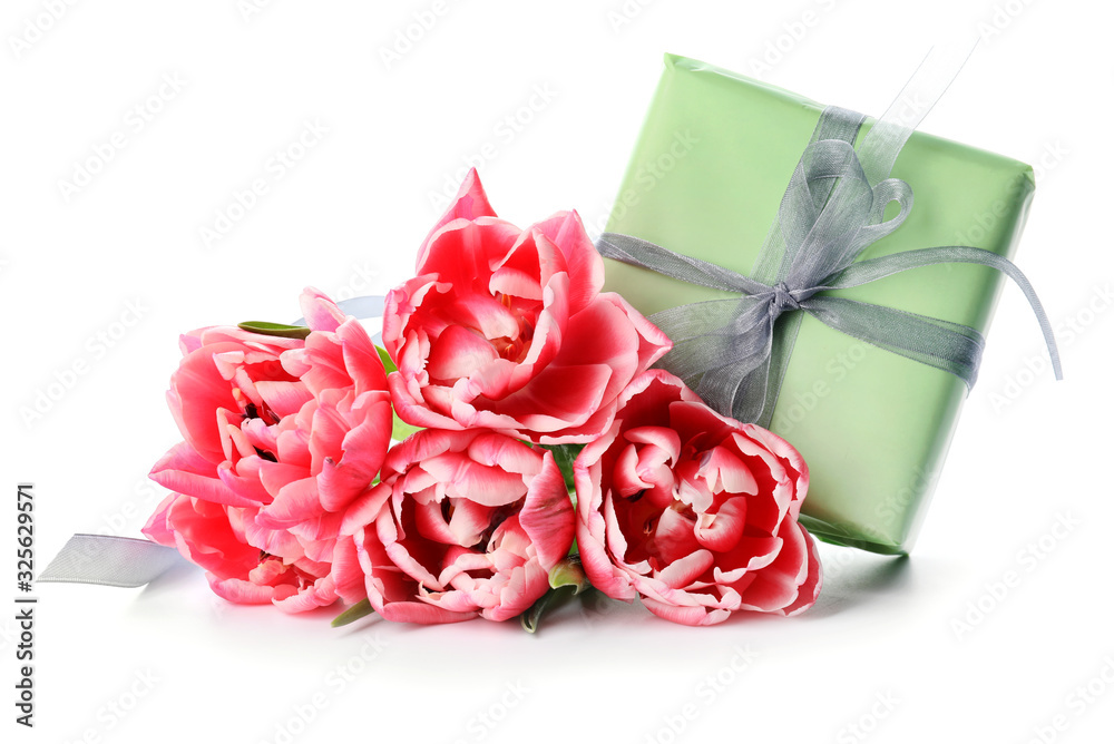 Bouquet of beautiful flowers and gift on white background