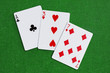 Three, Seven, Ace - playing cards combination on green baize