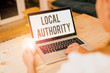 © Artur - Conceptual hand writing showing Local Authority. Concept meaning the group of showing who govern an area especially a city