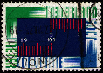 Wall Mural - NETHERLANDS - CIRCA 1975: Postage stamp 50 dutch cents printed in the Netherlands (Holland), shows International Metre Convention symbol, circa 1975