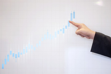 Business hands pointing a presentation board with the financial chart