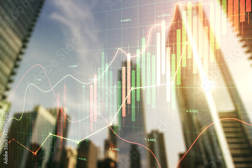 Fotografía Multi exposure of abstract financial chart on office buildings background, resea
