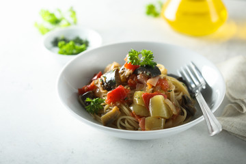 Spaghetti with vegetable ragout and fresh parsley