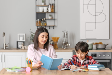 Sticker - little boy with his mother doing homework in kitchen