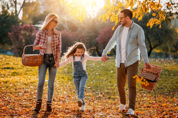 Wall Mural - Happy family having picnic in the park