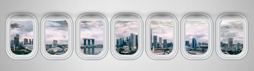 Canvas Print - Airplane windows with Singapore skyline view. Travel and holiday abstract concept