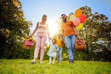 Happy family having picnic in the park