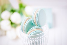 Mint Or Tiffany Color Macaron Or Macaroon Dessert With Vanilla Cream In Glass. Copy Space