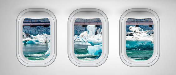 Canvas Print - Airplane windows with Iceland Jokulsarlon Lagoon view. Travel and holiday abstract concept