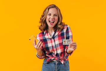 Sticker - Image of young beautiful woman holding cellphone and credit card