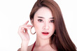 © Sasils Production - Portrait of beautiful thai woman isolated in white background. Sexy mouth and hand raise.