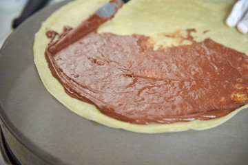 Poster - Putting chocolate sauce on crepe 