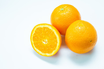 Wall Mural - Fresh orange cut fruit on white background