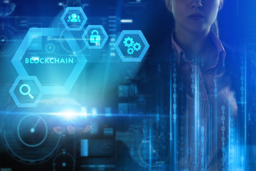 Business, Technology, Internet and network concept. Young businessman working on a virtual screen of the future and sees the inscription: Blockchain