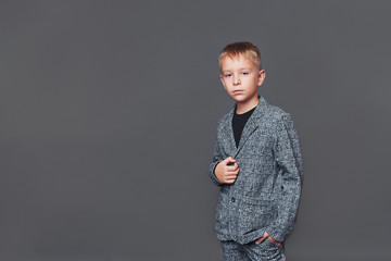 fashionable guy in a jacket. studio shooting boy. fashion.