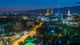 Fototapeta Miasto - Ostankino tv tower and stalin skyscrapers near railway station night timelapse. Residential buildings and roofs at summer in Moscow, Russia