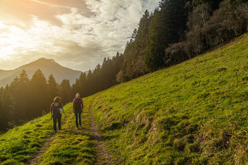 two women hiking through the mountains of switzerland