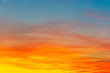 © Massimo - Bright orange and yellow colors sunset sky. Yellow blue sunrise sky with sunlight