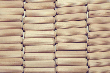 Wooden dowels background or texture, closeup front view.