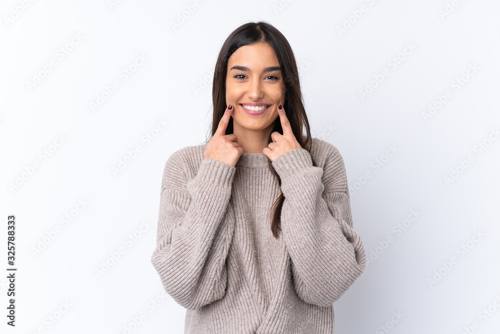 Young brunette woman over isolated white background smiling with a happy and pleasant expression - obrazy, fototapety, plakaty 