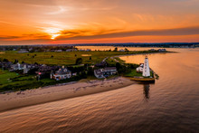 Summer Sunset In Old Saybrook Along The Connecticut River With Lynde Lighthouse In The Foreground And A Summer Sunset
