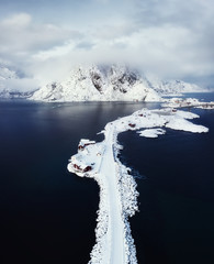 Canvas Print - Aerial view on the Hamnoy village, Lofoten Islands, Norway. Landscape in winter time during blue hour. Mountains and water. Travel - image