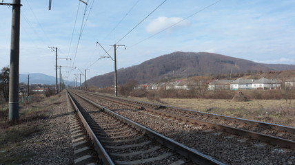 rails, sleepers, railway and poles along the tracks