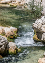 Burano River in Cagli with waterfall and clear water