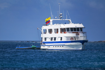 Wall Mural - Typical tourist yacht anchored at Suarez Point at Espanola Island, Galapagos National park, Ecuador