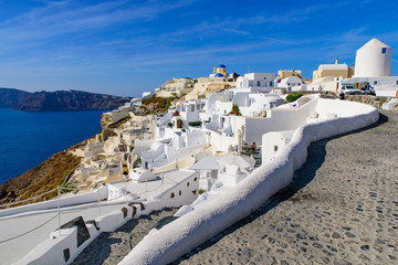 Traditional white buildings facing Aegean Sea in Oia, Santorini island, Greece