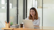 © bongkarn - Cropped shot of  of businesswoman sit at her working place in comfortable office room