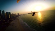 Paramotoring Powered Paragliding Ppg Flight High In Beautiful Evening Sunset Sky On Calm Blue Dubai Beach Ocean Seascape