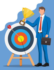 Poster - Happy businessman with trophy and dart target. Goal setting. Business man with briefcase. Smart goal. Business target concept. Achievement and success. Vector illustration in flat style