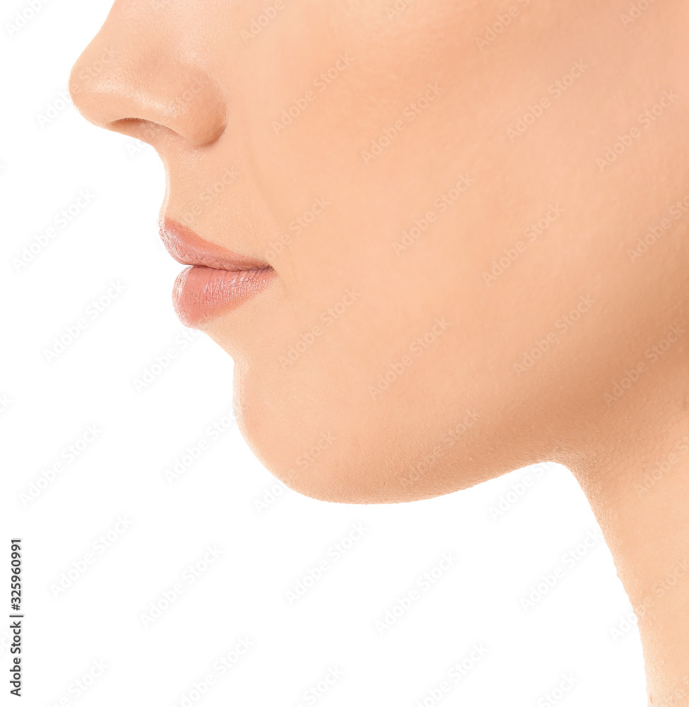 Beautiful young woman on white background, closeup. Plastic surgery concept