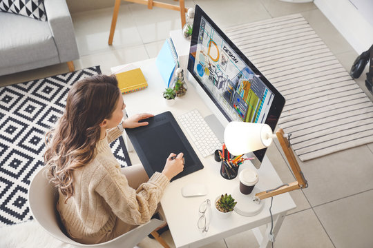 Female interior designer working in office