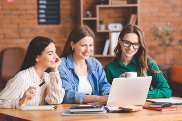 Sticker - Beautiful young businesswomen working together in office