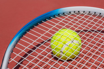 Wall Mural - Tennis racket and tennis ball on court.