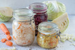 Fermented preserved vegetarian food concept. Cabbage sauerkraut sour glass jars