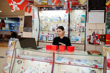Portrait Of Young Caucasian Female Woman Seller Hold Red Gift Boxes. Small Business Of Candy Souvenirs Shop.