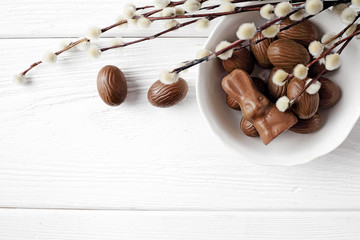 chocolate easter eggs on wooden background. copy space for text