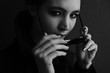 © Oleg Samoylov - Black-white close-up portrait of a beautiful young girl in black round sunglasses.Girl poses for the photographer.Fashion portrait