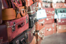 Pile Of Colorful Vintage Suitcases.