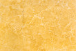 Good quality yellow marble texture, macro shot. Small marble veins and light scratches. Yellow marble surface background.