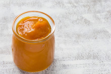 Pumpkin Puree In Glass Jar On The White Background