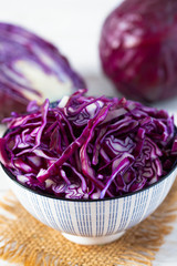 Poster - red cabbage on white wooden surface