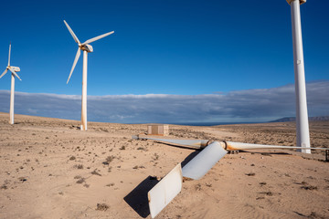 A row of wind turbines in the desert