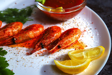 fried shrimp with various spices, lemon and sauce