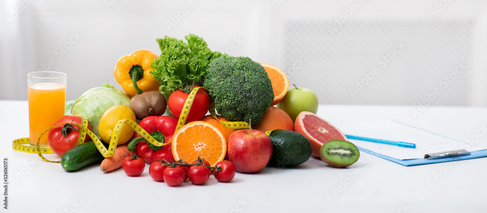 Nutritionist's workplace with fruits, vegetables, measuring tape on table - obrazy, fototapety, plakaty 