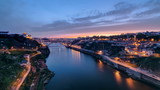Fototapeta Miasto - Day to Night view of the historic city of Porto, Portugal timelapse with the Dom Luiz bridge